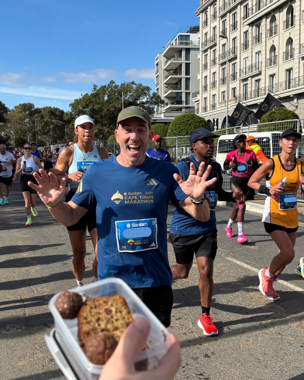 Alastair holding Verdant Life banana bread at the Cape Town Marathon.